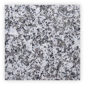 Texture de granit gris avec motifs variés.