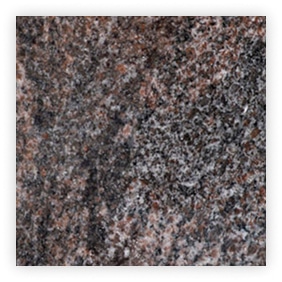 Texture de granite avec nuances de gris et rouge.