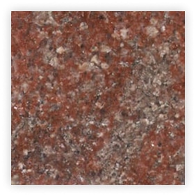 Surface de granite rouge avec des motifs variés.